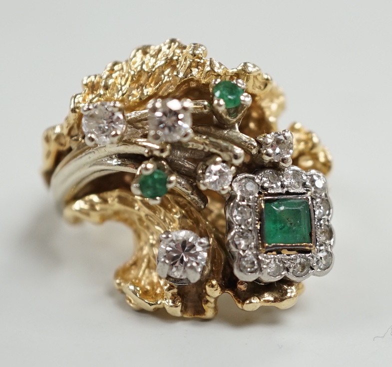 A modern 14k, emerald and diamond cluster set modernist dress ring, size L, gross weight 13.4 grams.